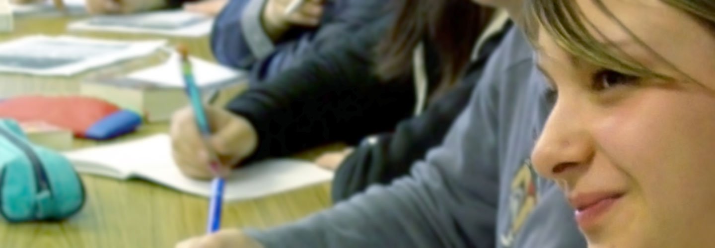 Students and host family enjoying a meal together